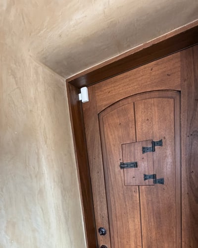 Entry sensor installed on a wood door in Santa Fe