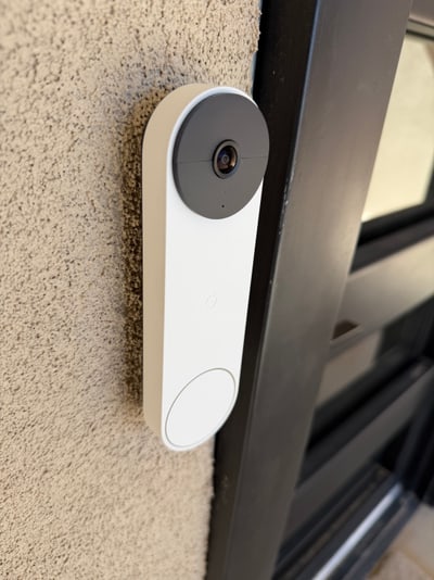 Close view of a cleanly mounted Google video doorbell