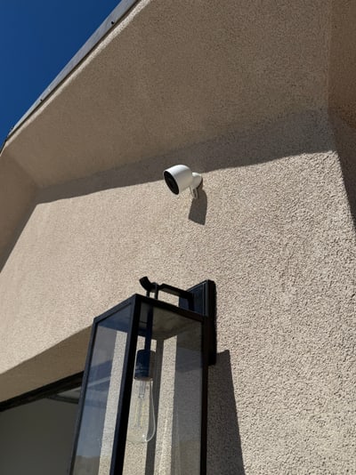 Exterior Google camera installed beneath an eave in Rio Rancho